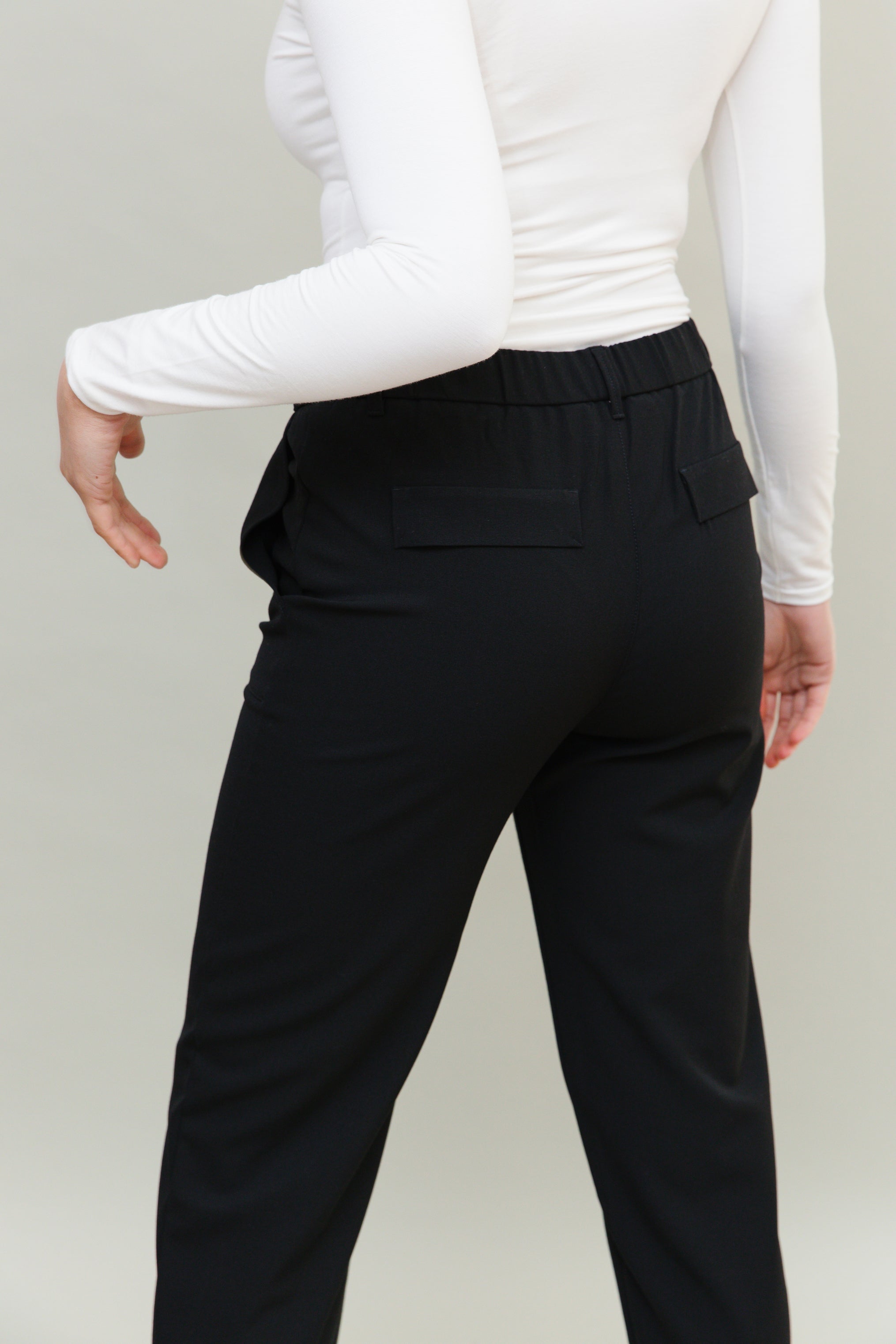 Modern Tapered Leg Black Trouser, elasticated waist, pockets and darted taper at hem